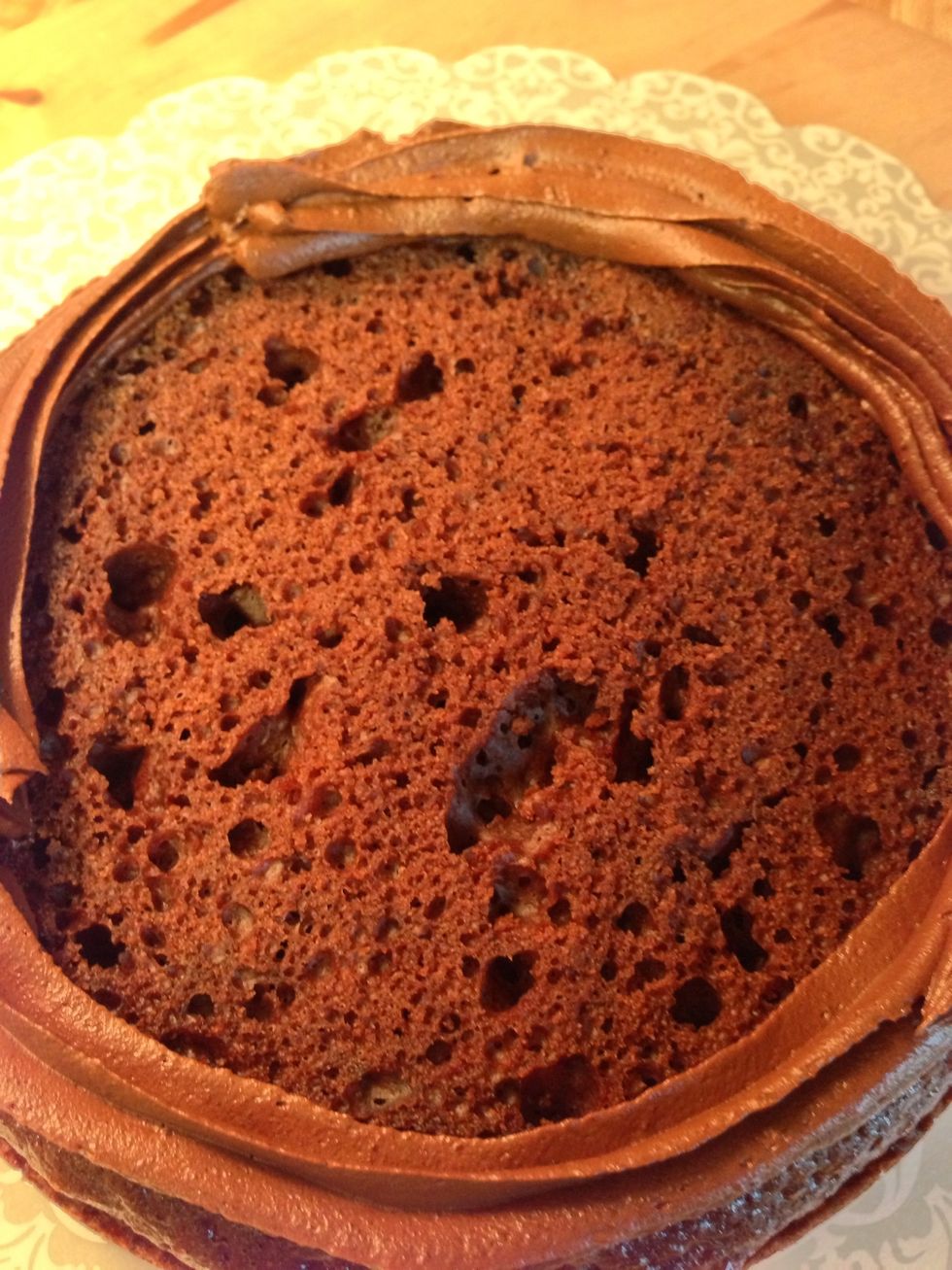 Place your first layer on a serving dish. I put a dam of frosting on the outside edge of my cake so the filing wouldn't squish out. The dam is totally optional.