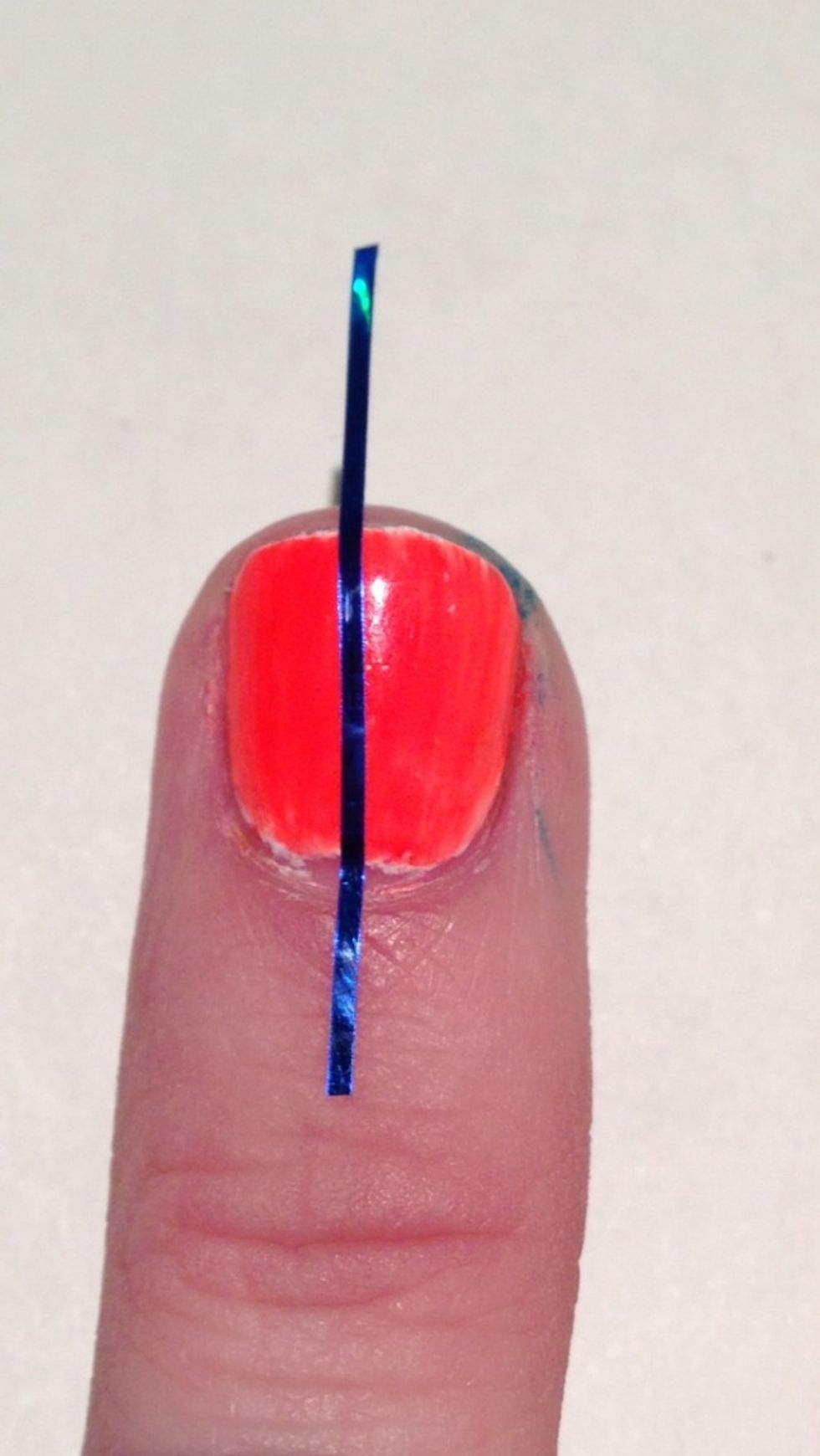 Place your first piece down the middle of your nail.