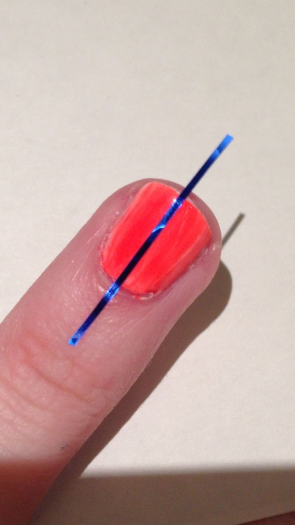 Place your first piece vertically down the middle of your nail.