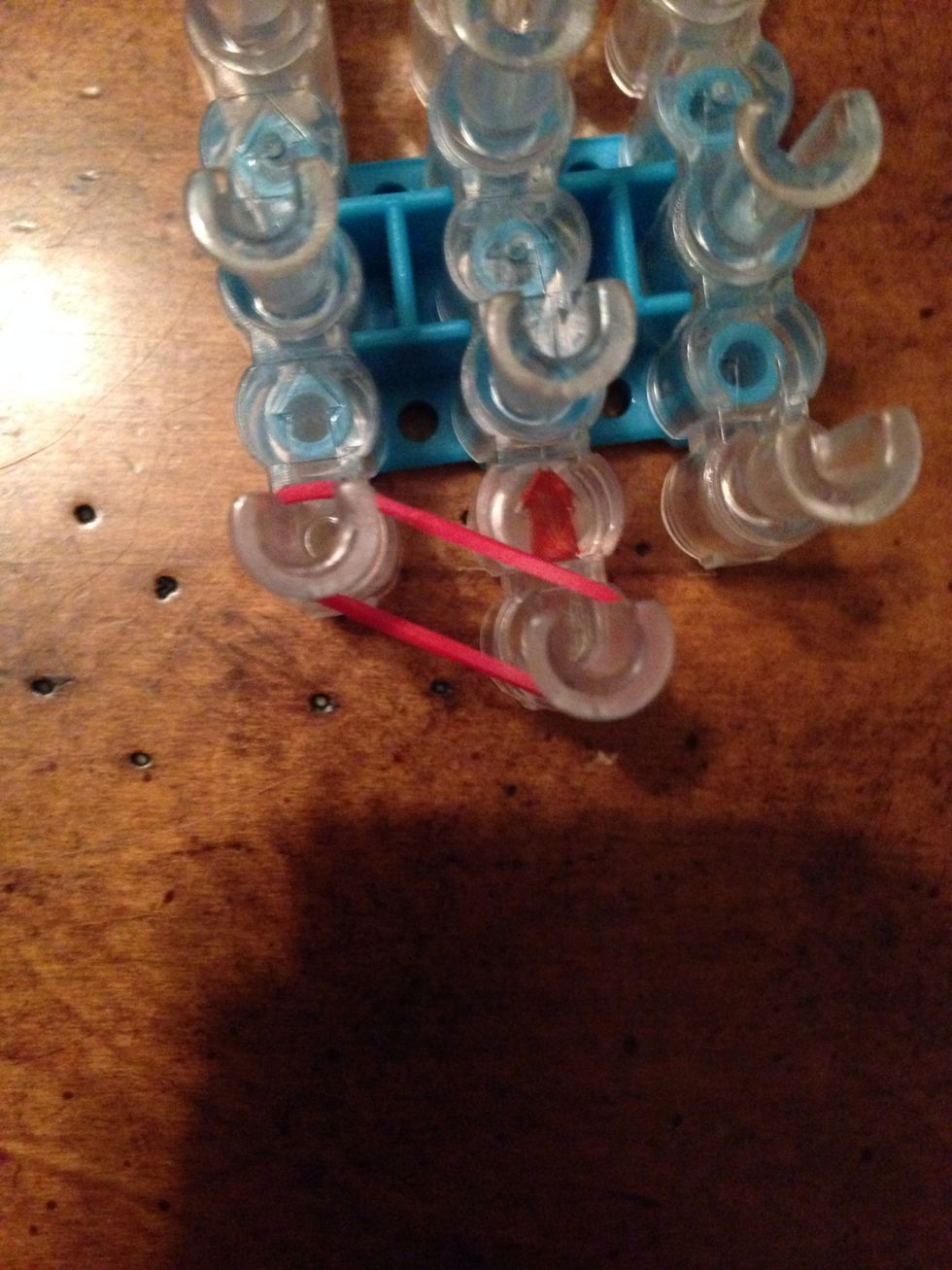 Place your first rubber band like it is shown above