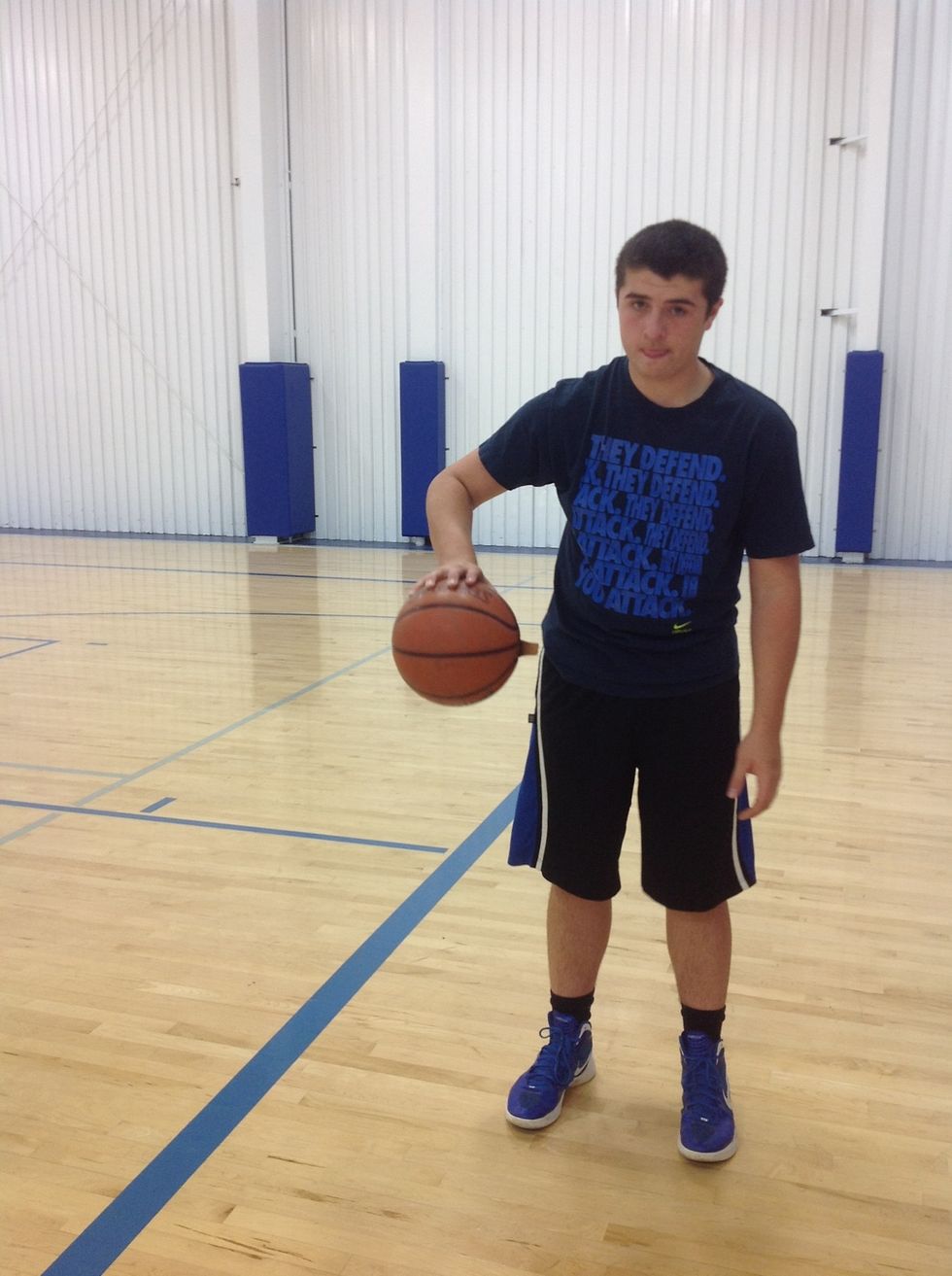 Place your hand on the top of the ball.