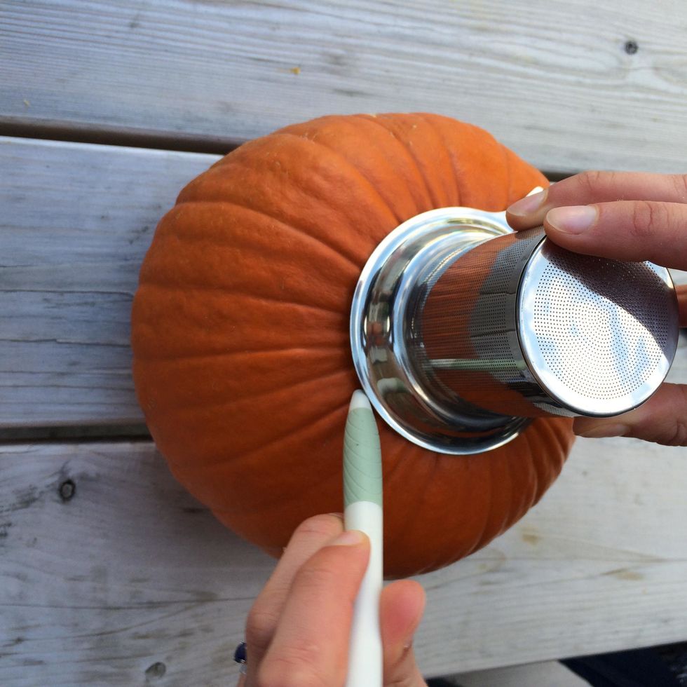 Place your infuser face down over the pumpkin stem so that it's flush with the top of the pumpkin. Then, using a pencil, trace an outline around the infuser (you may need to trim the stem for this).