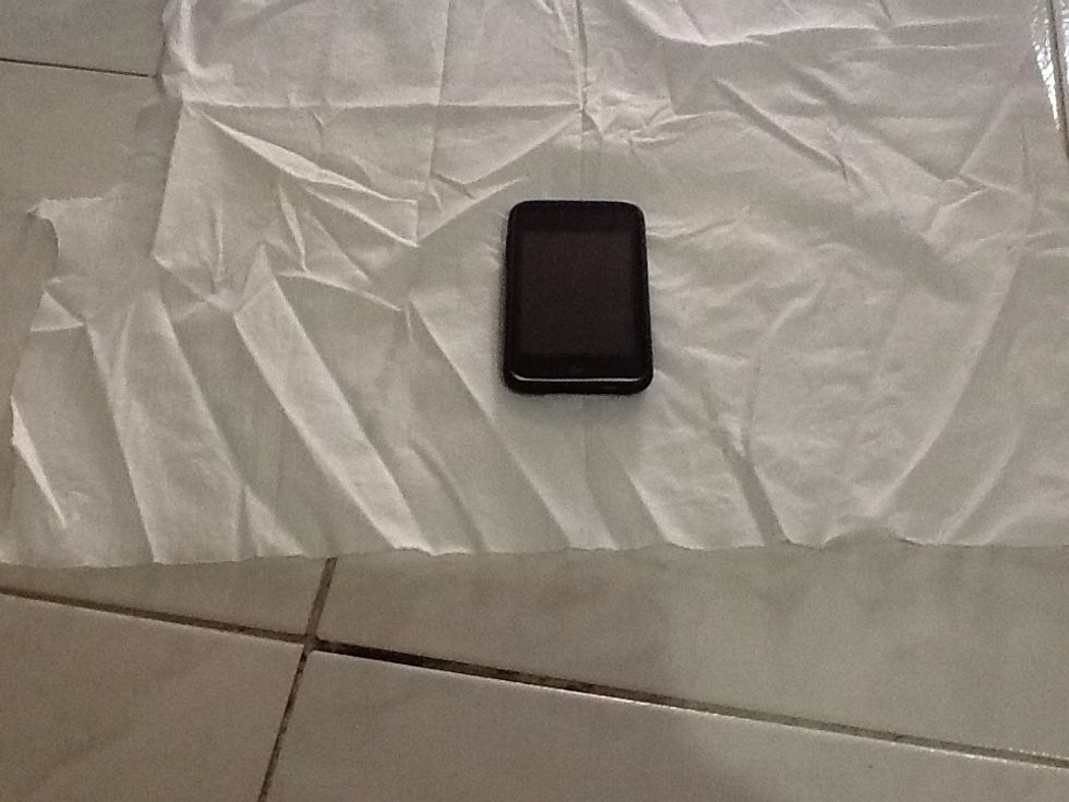 Place your ipod or phone / device .. A couple inches away from the bottom of the fabric