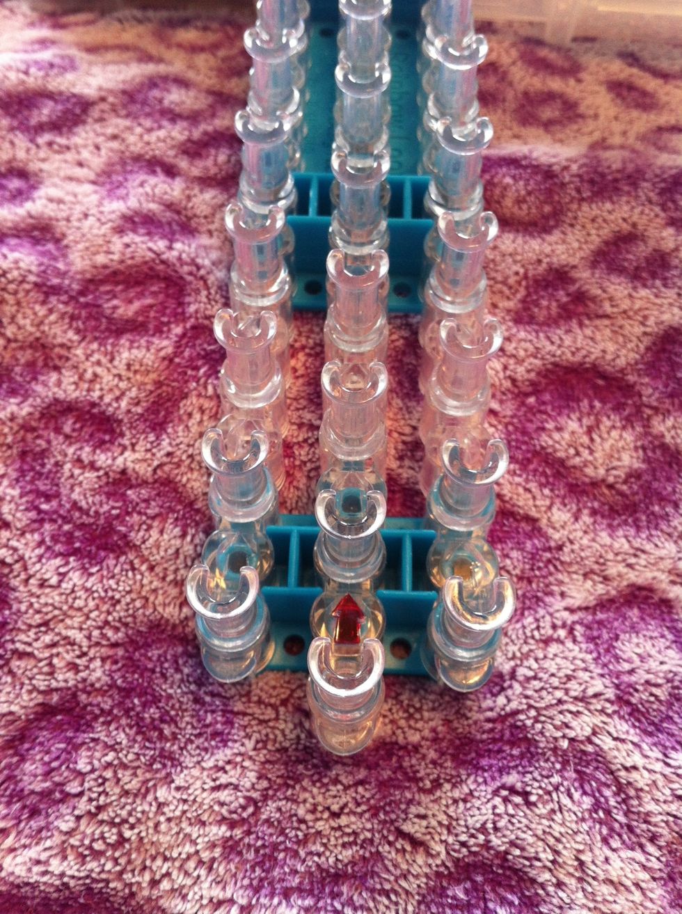 Place your loom so the arrows are pointing away from you.
