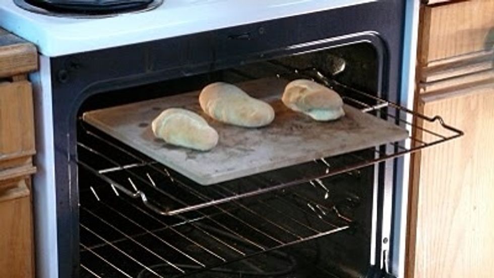 Place your naan breads on the hot pizza stone and carefully slide them into the oven and bake them for about three minutes or so. They'll puff up and brown.