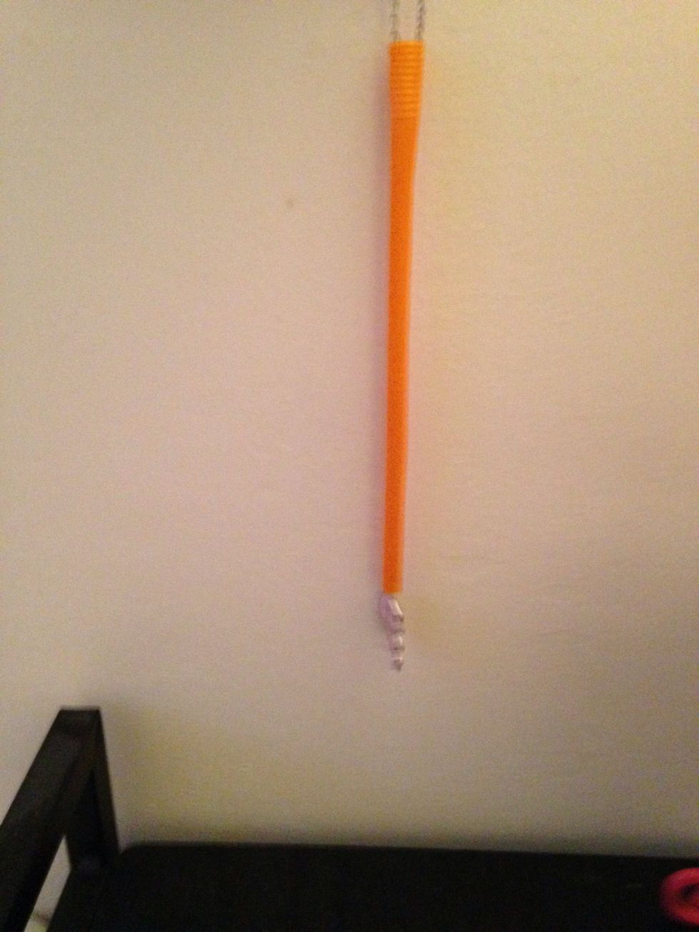 Place your necklace in the straw