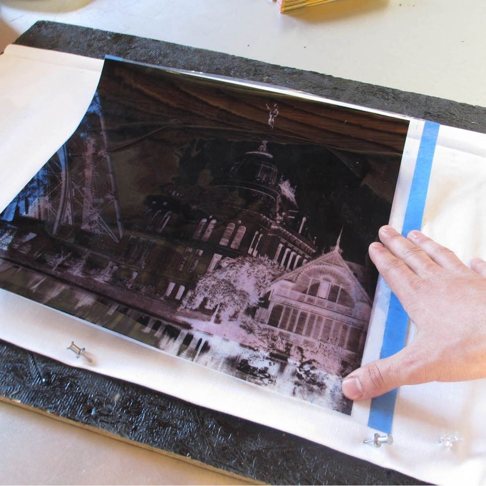 Place your negative on top of your fabric (If you're using an inkjet printed negative make sure to put the waterproof side down so as not to smear it).