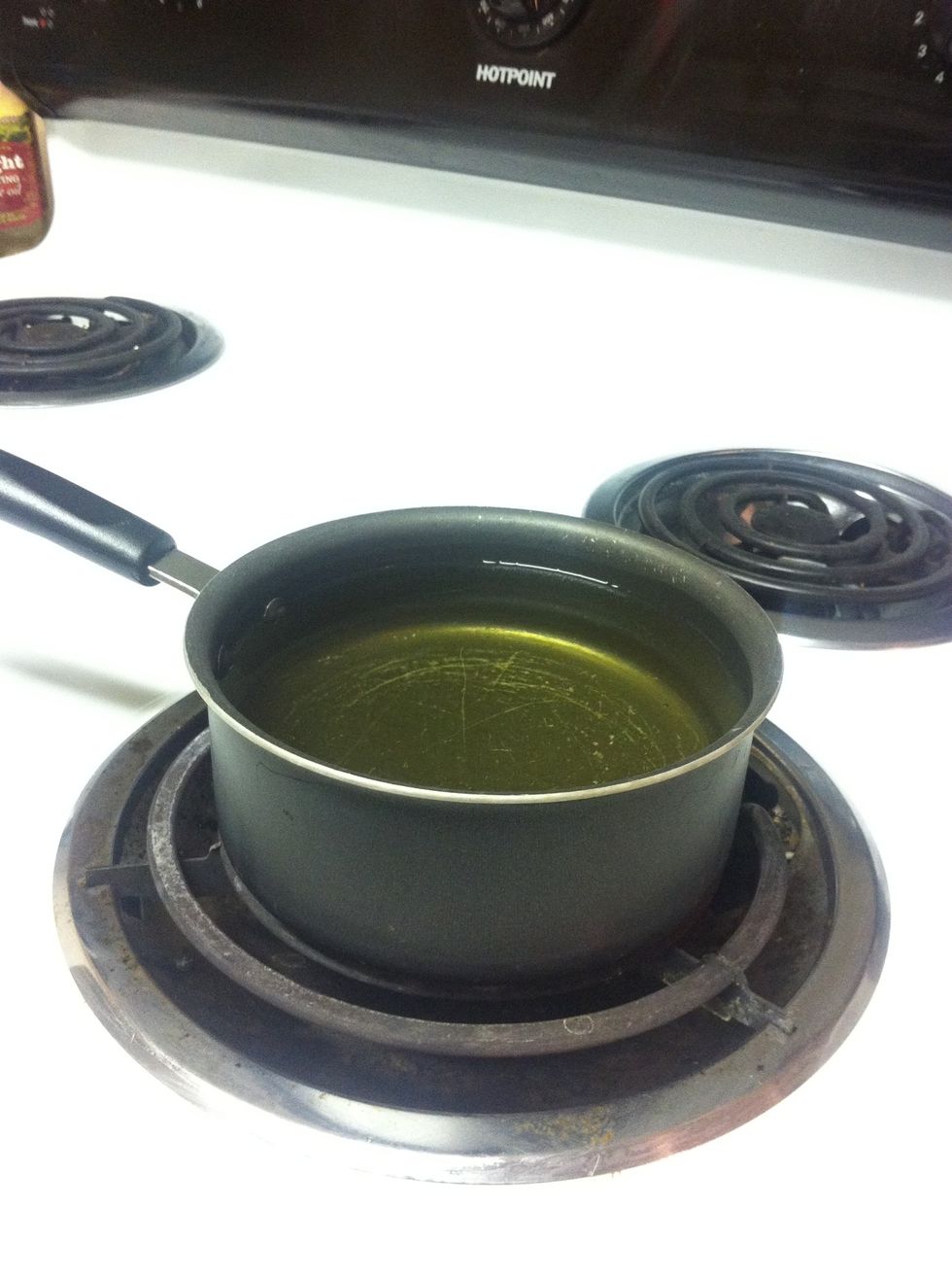 Place your oil in a pot or deep fryer. Heat to about 350 degrees F. If you don't have a thermometer, flick a drop of water in the oil and it should boil out right away.