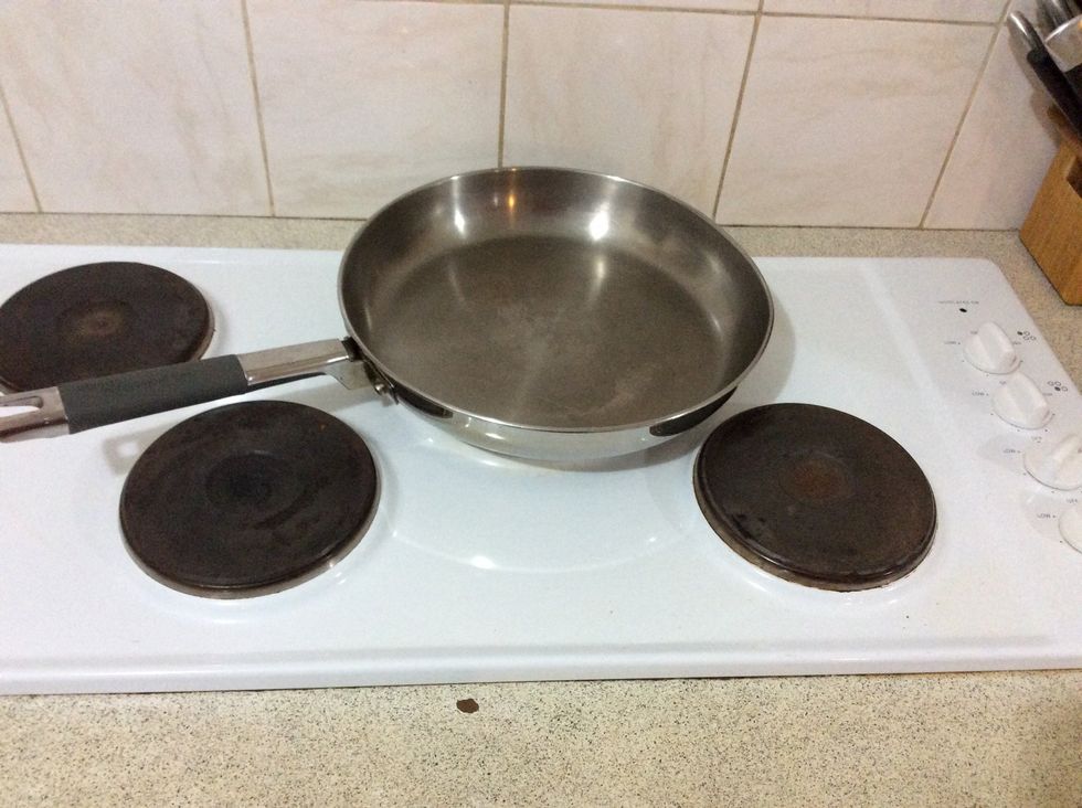 Place your pan about the size of a large pizza on your cook top and wait for it to heat up. Test to see if your cooktop is heated by hovering your hand 10cms above the pan. DONT BURN YOUR HAND!!!!