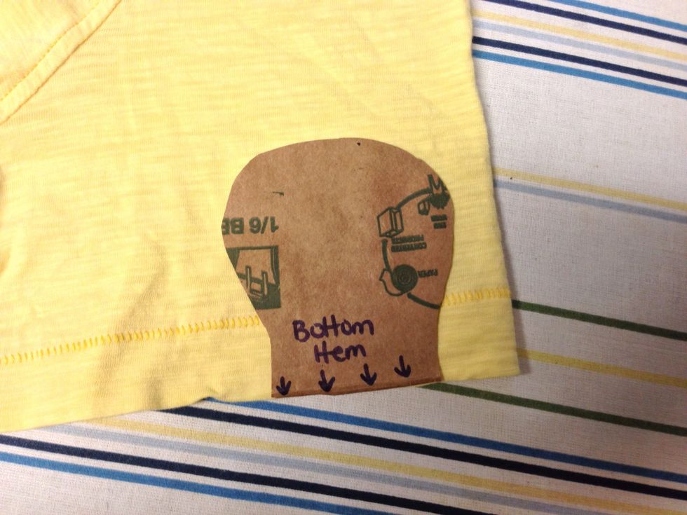 Place your pattern on your fabric. Make sure the opening of the mitten is on the bottom hem.