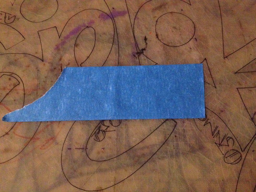 Place your pc of tape on a clean cutting area or board gently. You want to make it easy to remove without tearing once you cut out your pattern