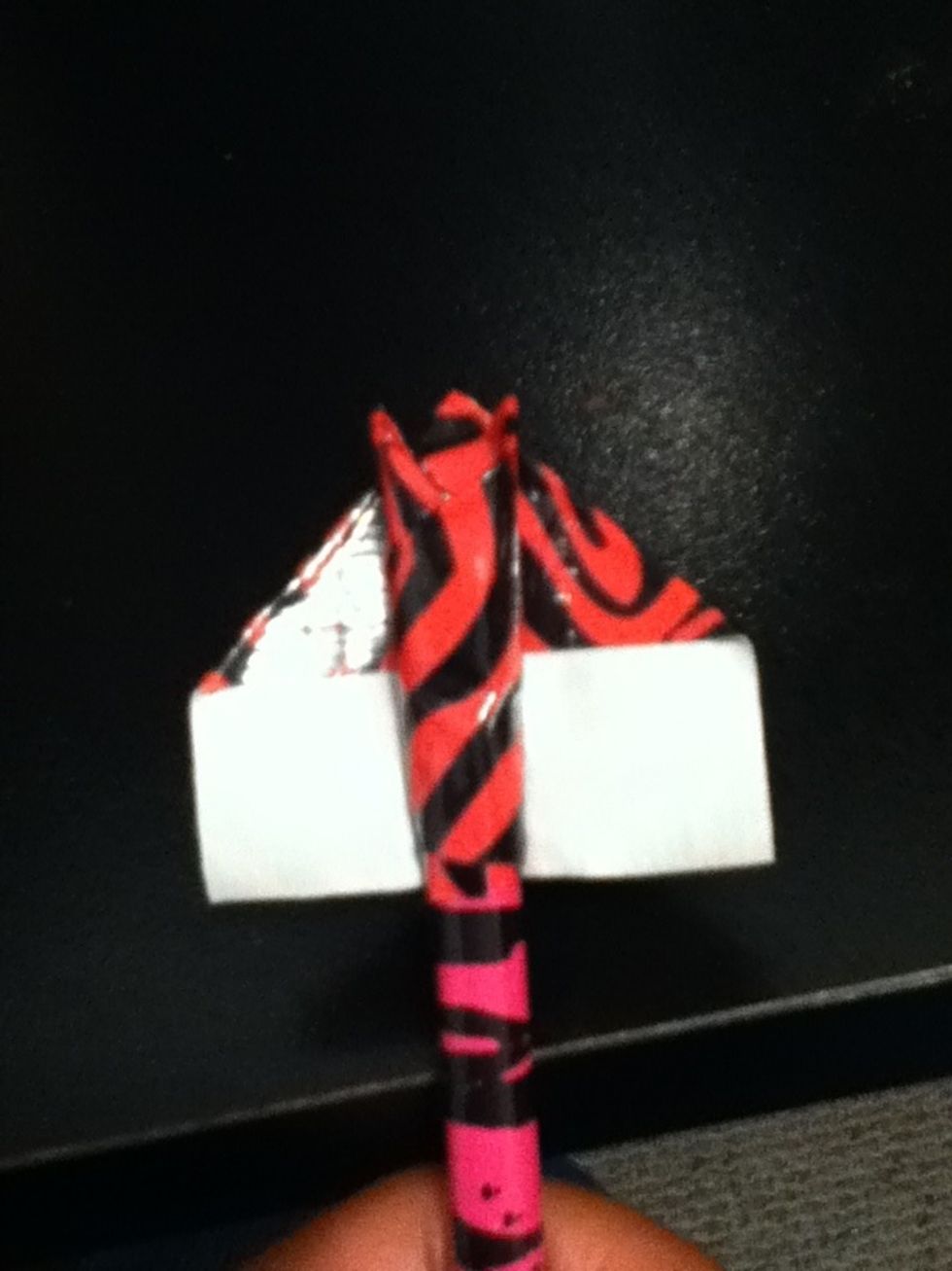 Place your pencil on another piece of duct tape like this.