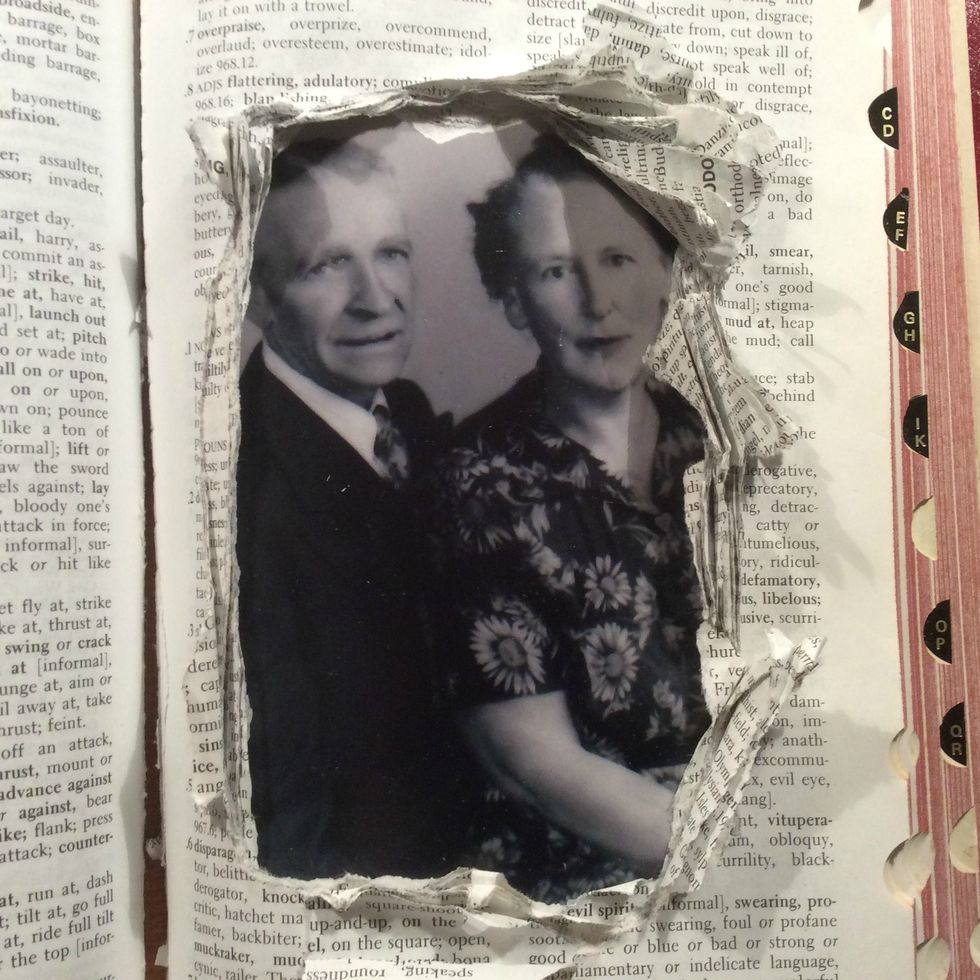 Place your photo under all the photos to make sure it fits appropriately. I spritzed the pages with water and then bent them around a skewer.