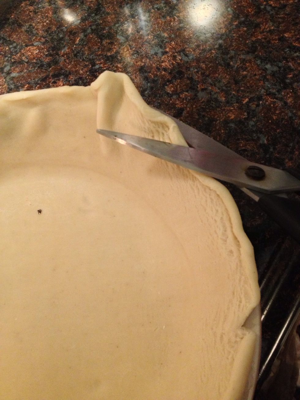 Place your pie crust on your pan and trim the edges