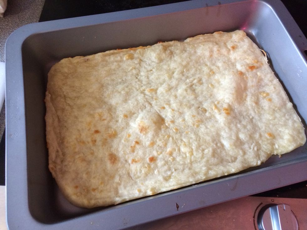 place your pizza base onto a tray.