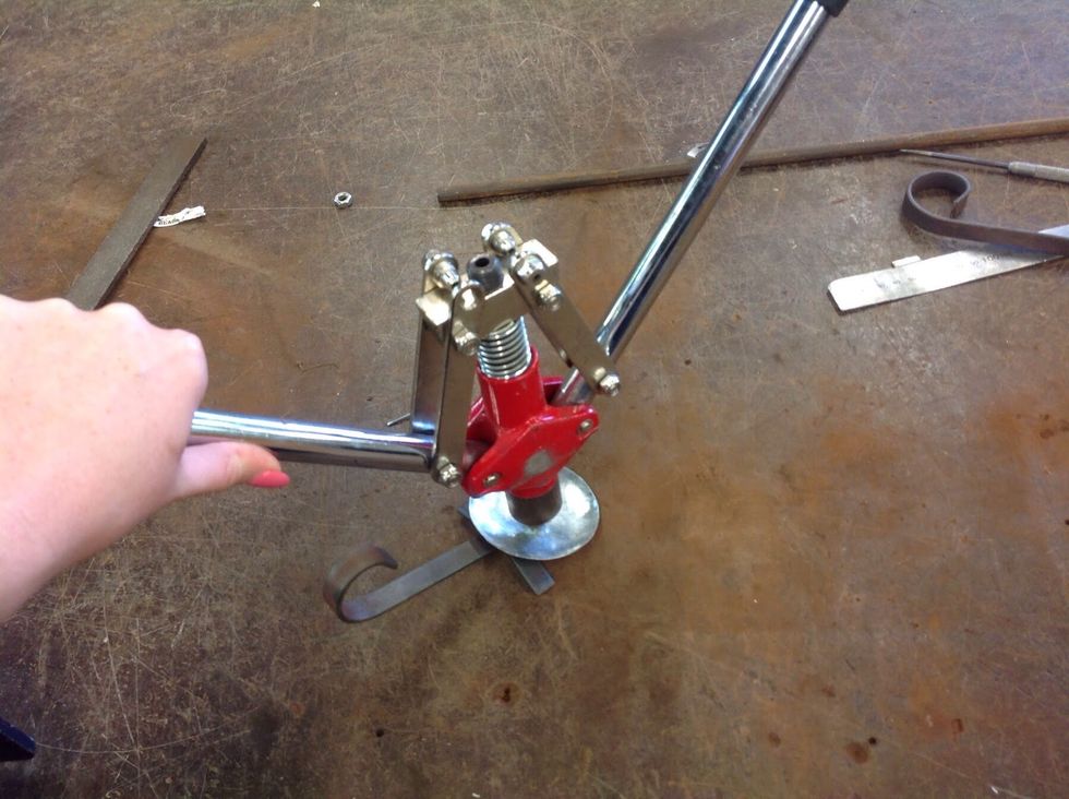 Place your pop rivet fun on the needles end of the POP rivet and begin throws pump itonce