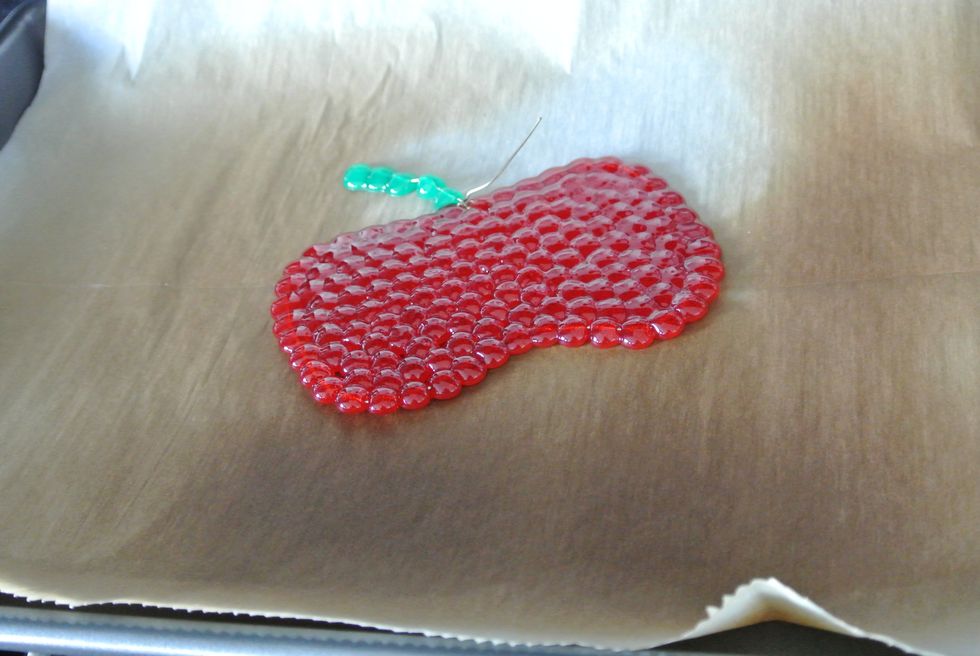 Place your project in a COLD oven. Turn the oven on to 350 and let it stay in there for 4-6 min. The beads should melt in no more than 6 min. Keep checking them. You may smell plastic as it melts.