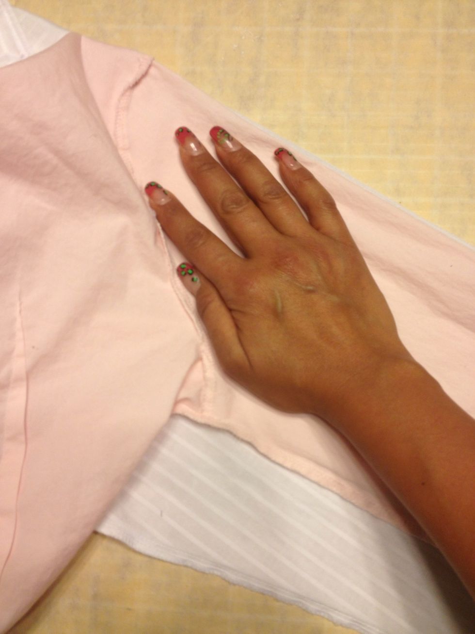 Place your right hand flat near the shoulder area & hold it down.