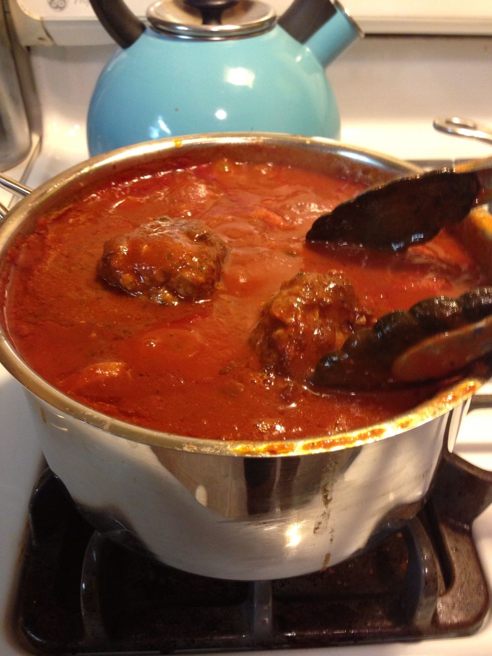 Place your seared meatballs into the sauce and continue to simmer for at least 45 minutes. Enough heat to bubble, but not a rolling boil. This will cook the meatball all the way through internally.