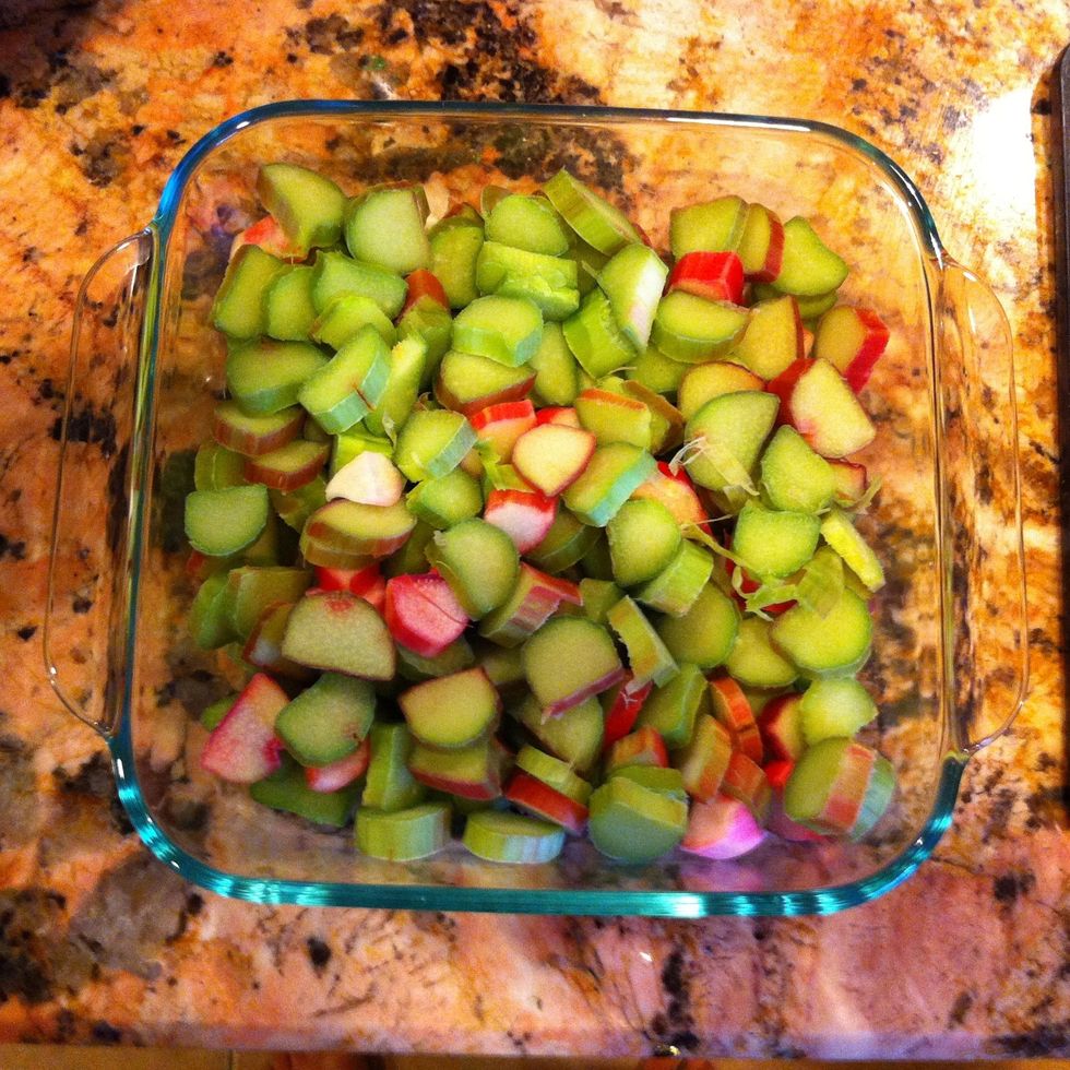 Place your sliced rhubarb in an un-greased 9 by 9 dish.
