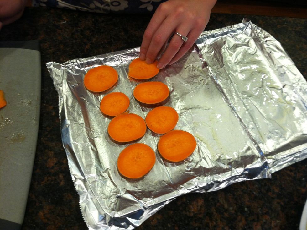 Place your sliced sweet potatoes side by side (try not to let the sides touch) on your baking sheet. Don't overcrowd the pan.