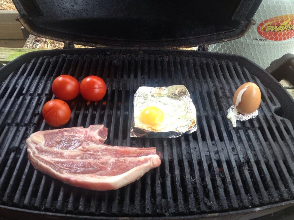 Place your small tomatoes and meat on the BBQ