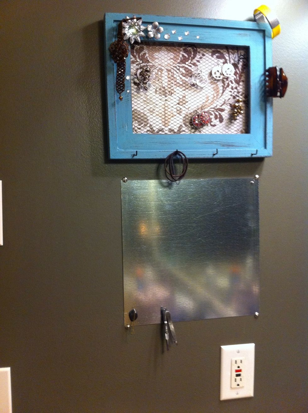 Place your steel sheet on the wall and put a few tacs around the edges