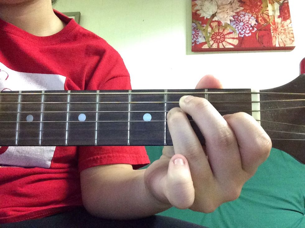 Place your third finger on the D string on the second fret right below your middle finger.