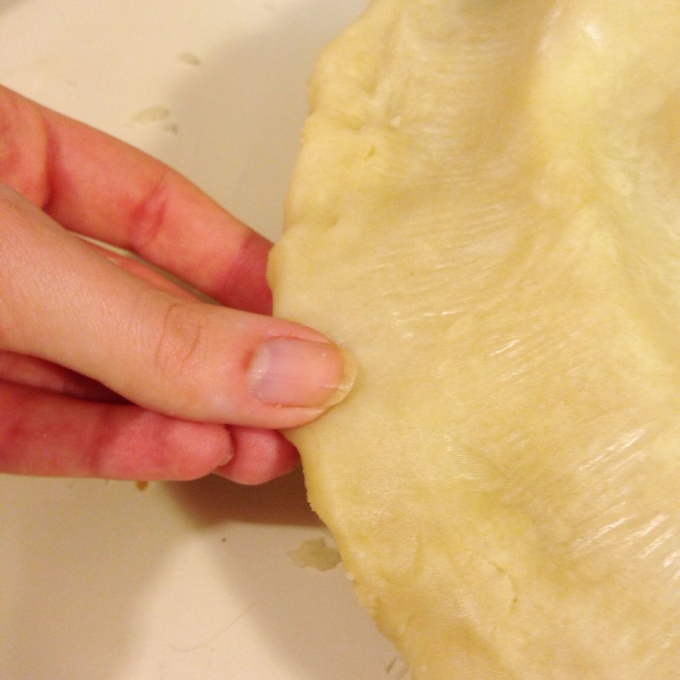 Place your top crust over the bottom crust, and seal the edges together all around.