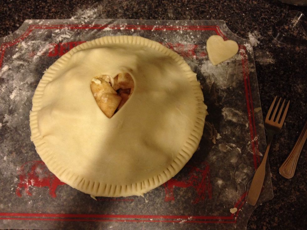 Place your top layer of crust on the apple filling, and peel off the excess. Use a fork to pinch down the sides. Preheat oven to 350 degrees, and place pie inside for an hour. :)