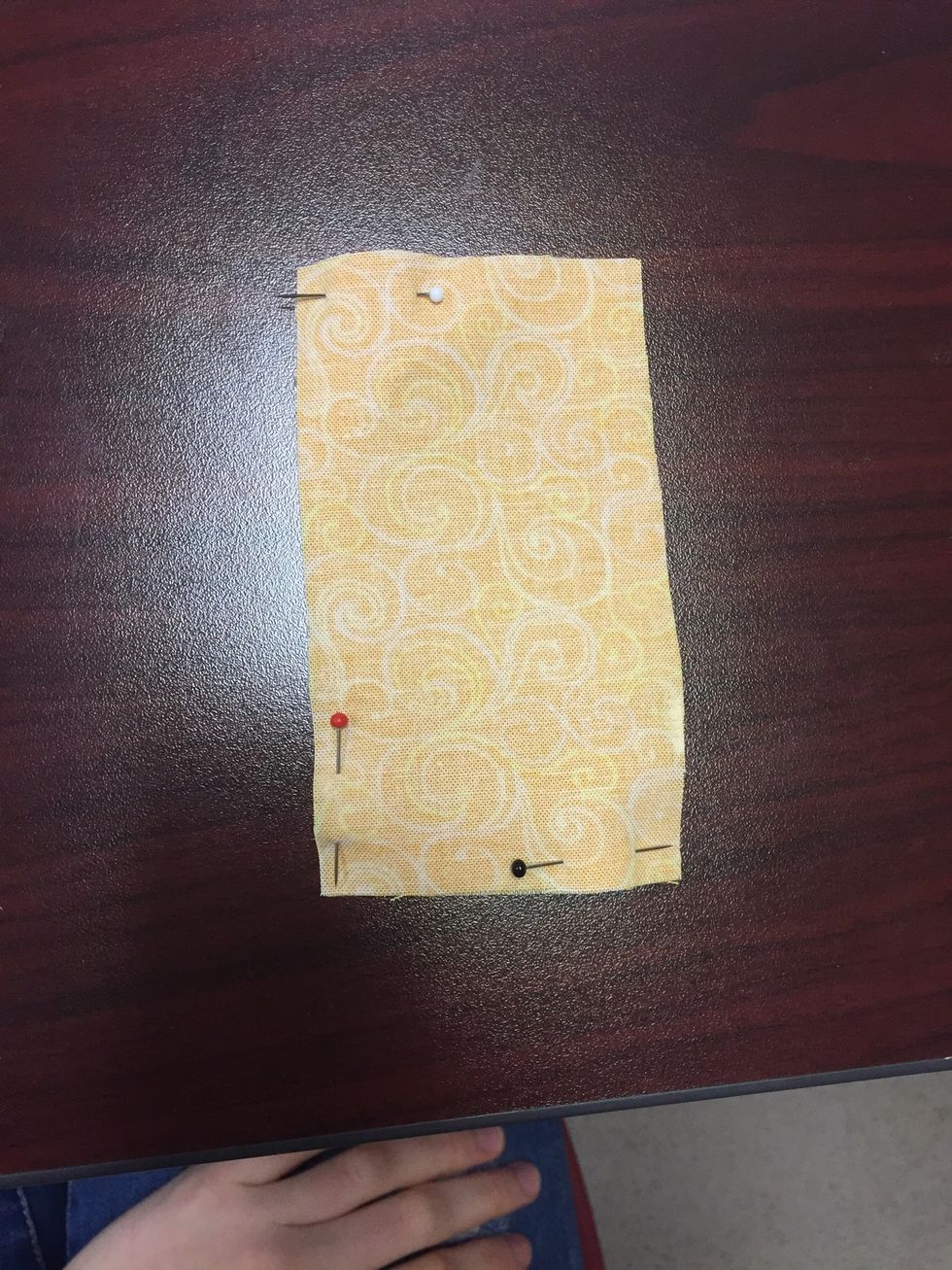 Place your two pieces of material right sides together and pin shut. Sew the two pieces together with a \u00bd inch seam allowance, leaving part of a long open.