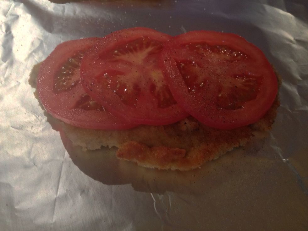 Placed on alu foil, add tomato some salt and pepper