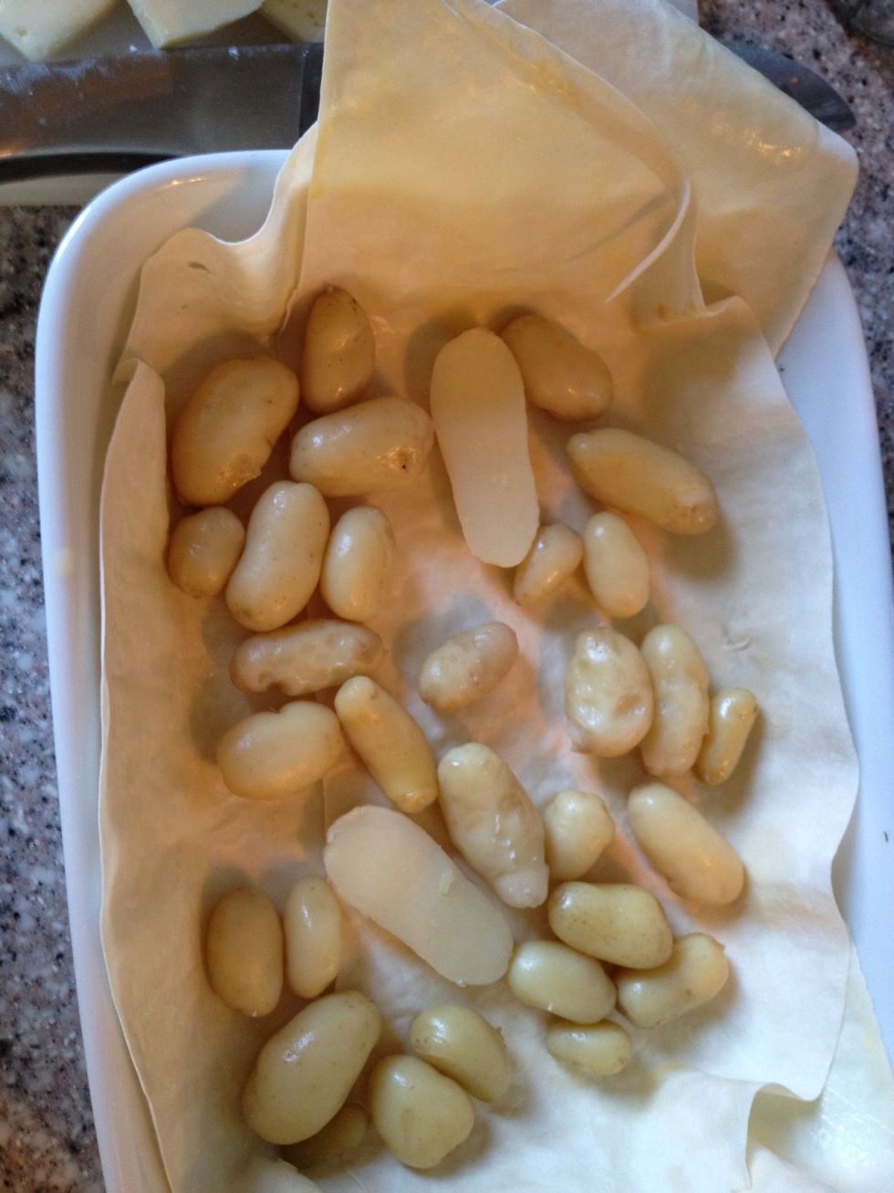 Placed the boiled potatoes in the bottom.