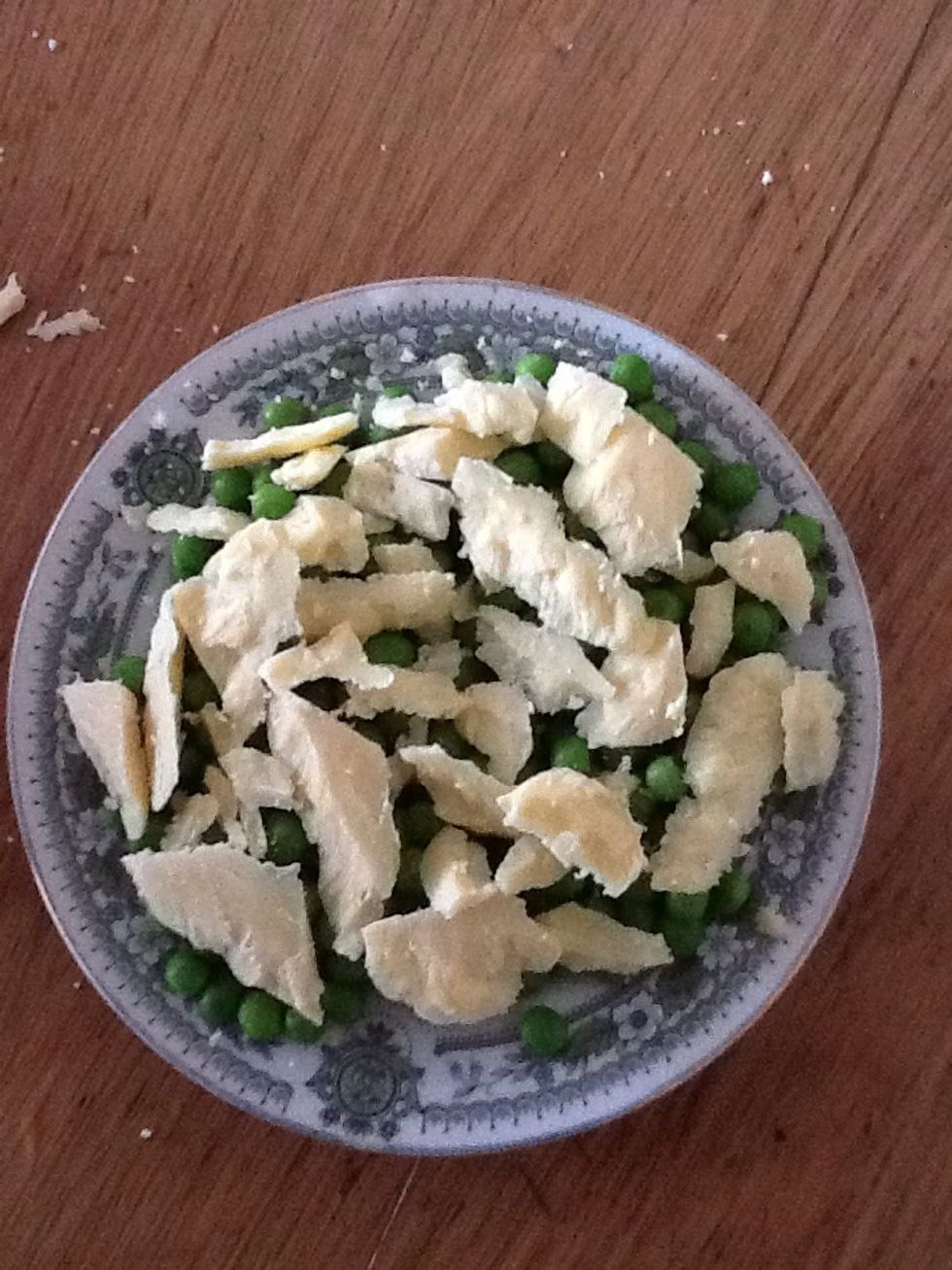 Places the small pieces onto the peas and place this under the grill until the cheese melts.....