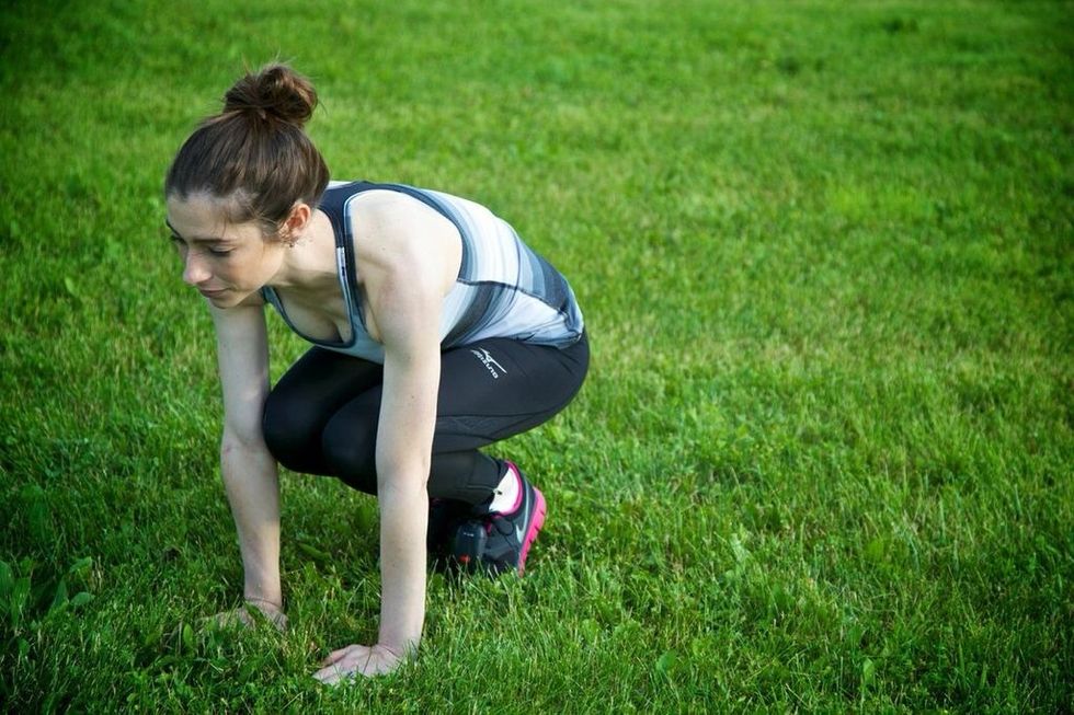 PLANK JACKS: To really increase the workout, complete one plank jack, then jump legs up towards your arms and back to starting. Complete 12 plank jacks.