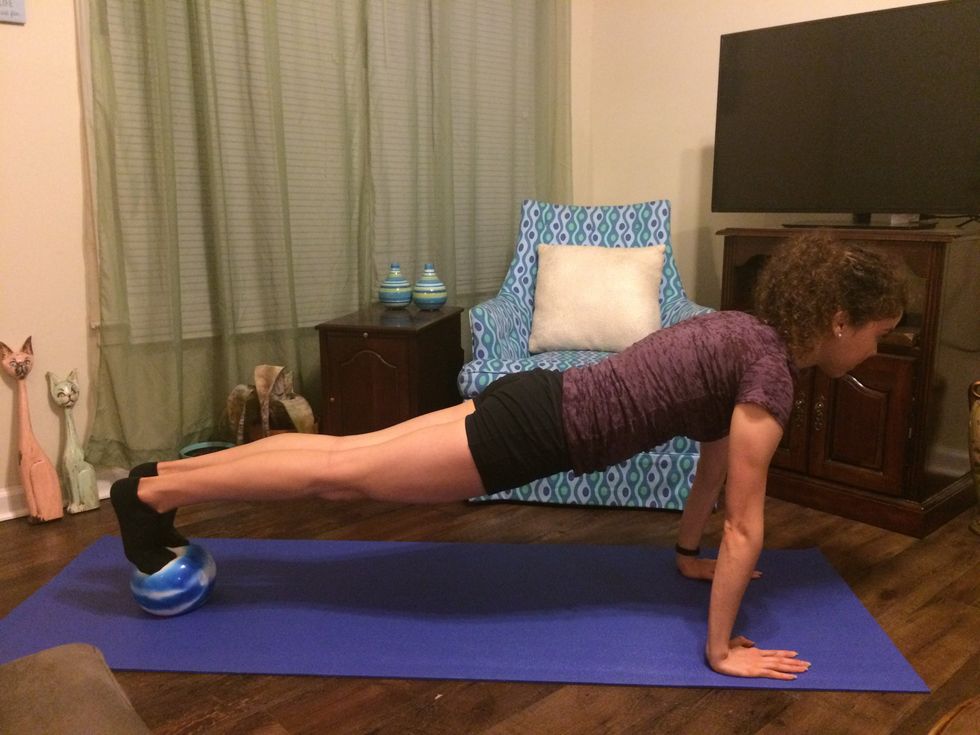 Plank Toe Taps: Move your leg back to center.