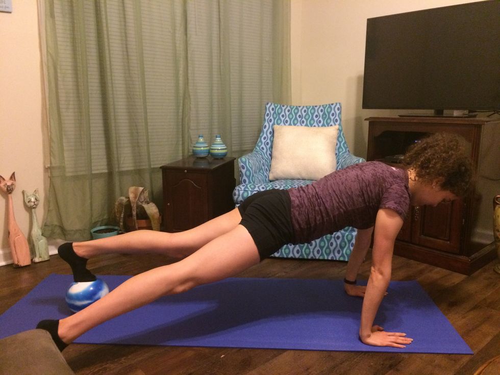 Plank Toe Taps: Step one leg out and tap the ground.