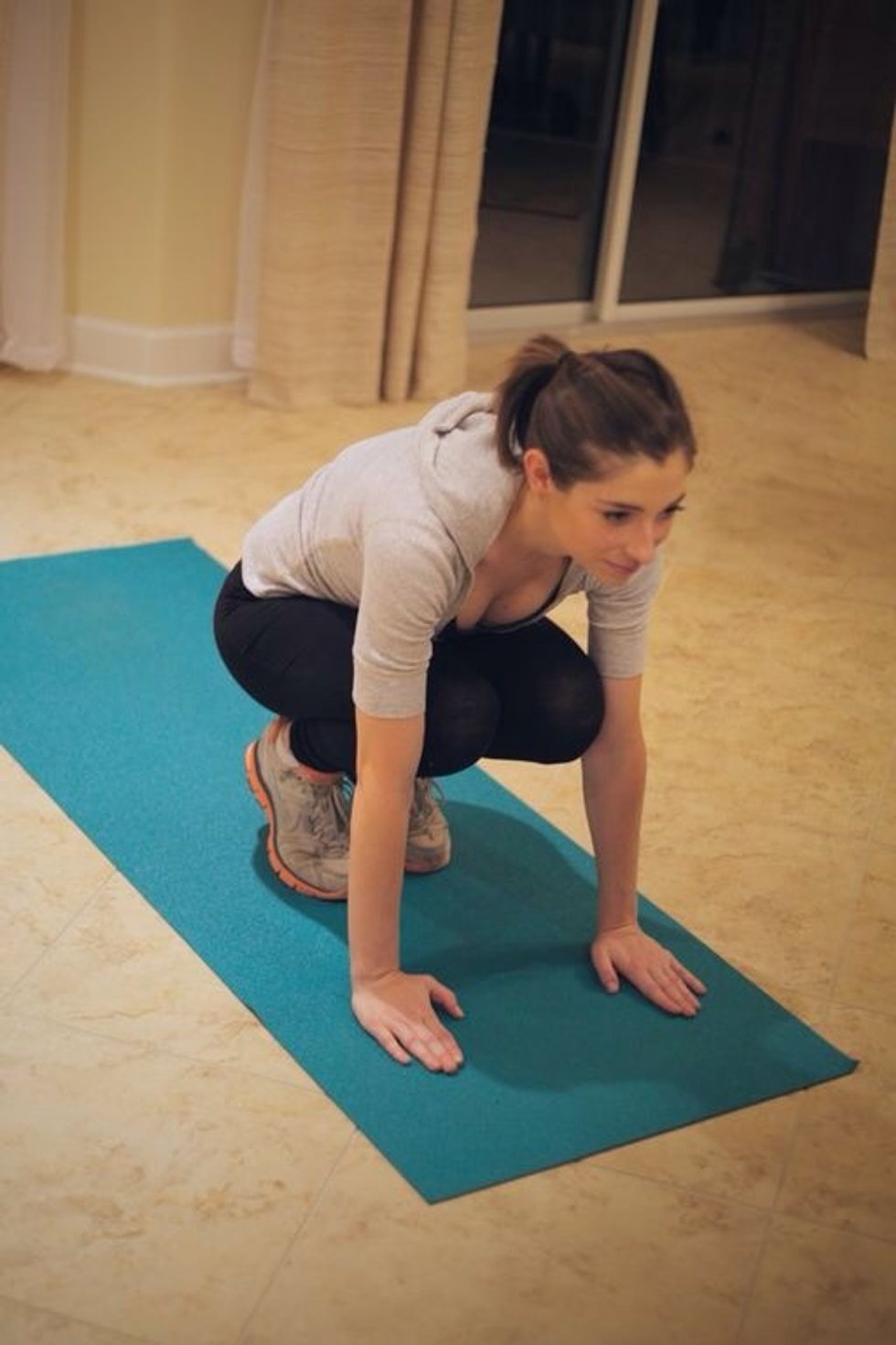 Plank Tuck: Jump your legs forward, then jump back into plank position. Alternate legs for 1 minute.