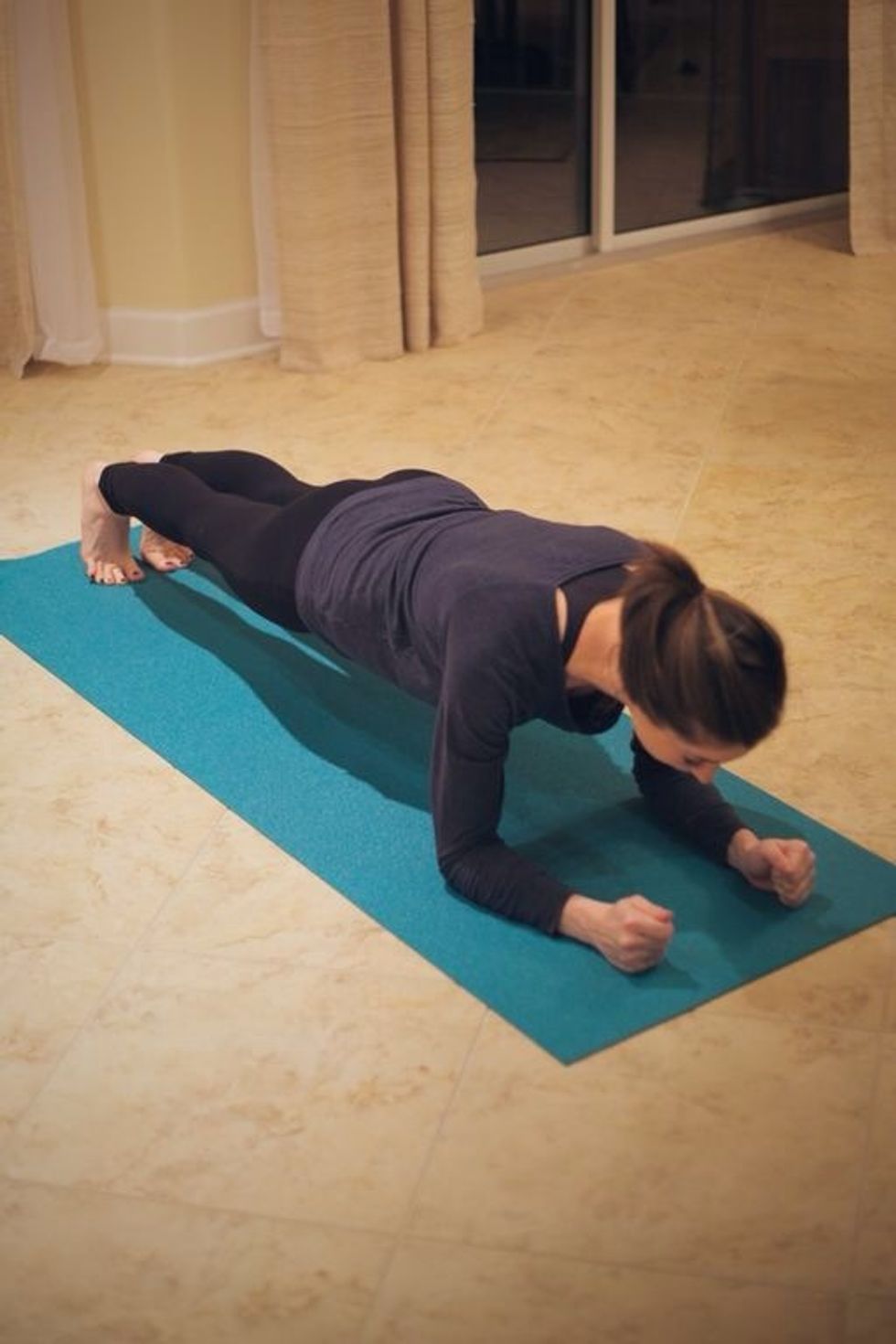 Plank tuck with leg extension: Go into plank position. Resting on forearms is optional.