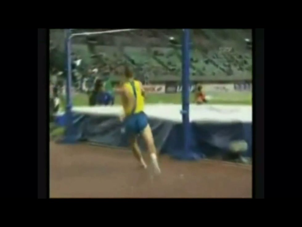 Plant the foot furthest away from the bar and lean away from the bar.