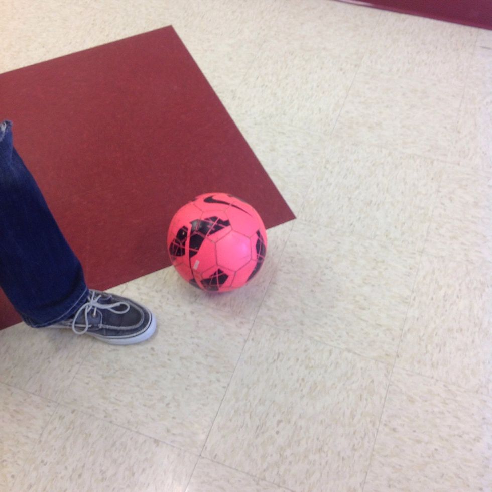 Plant your non-kicking foot a few inches behind the ball facing toward your target