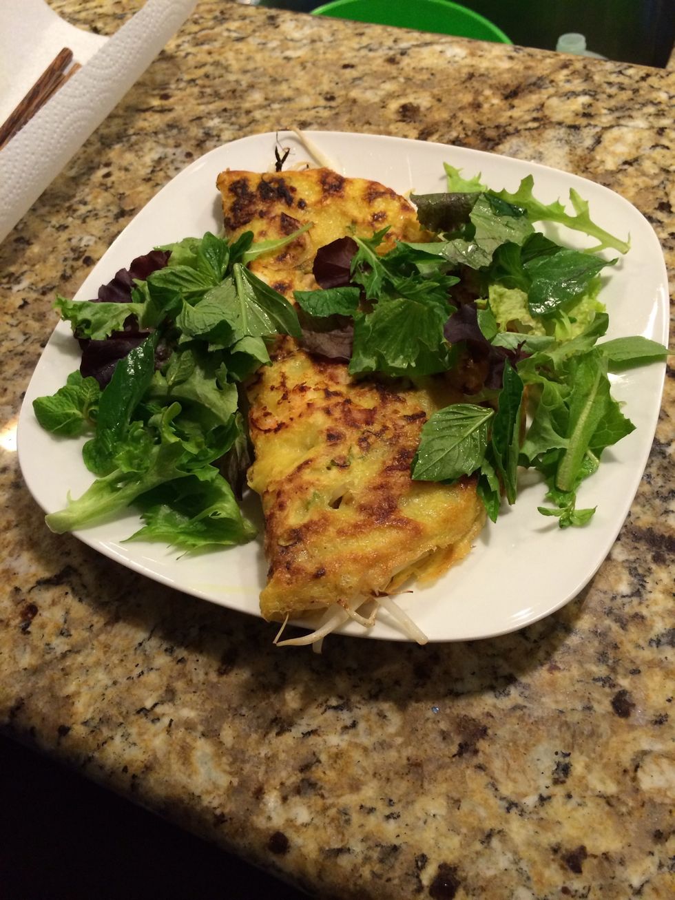 Plate the crepe and greens.