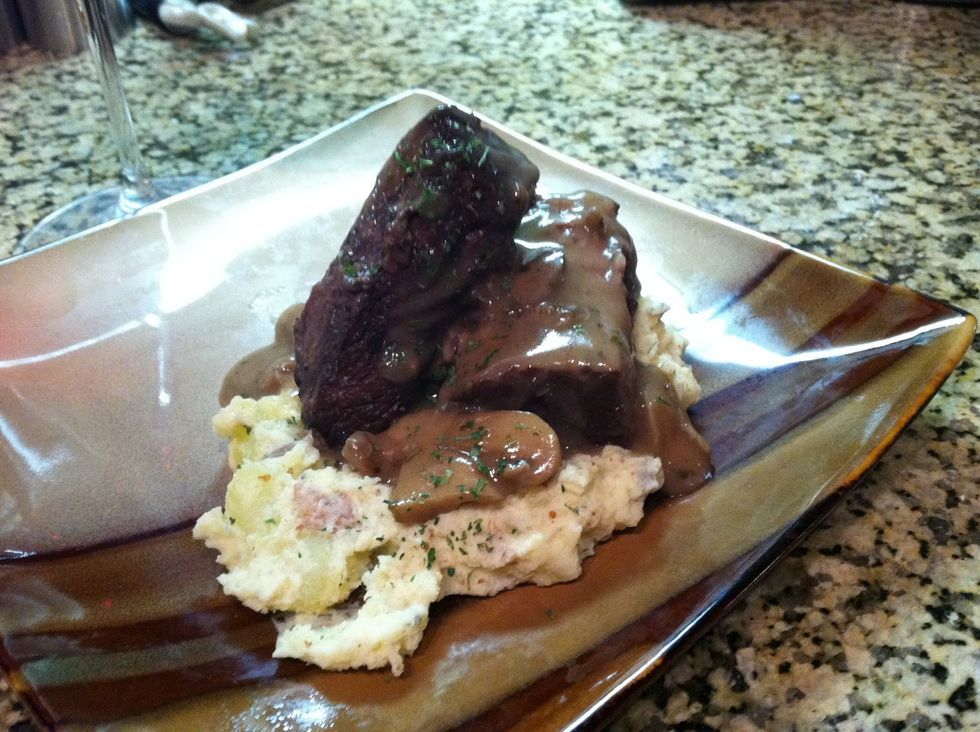 Plate your own personally whipped potatoes along with a healthy portion of stewed boeuf and spoon white mushroom sauce over...