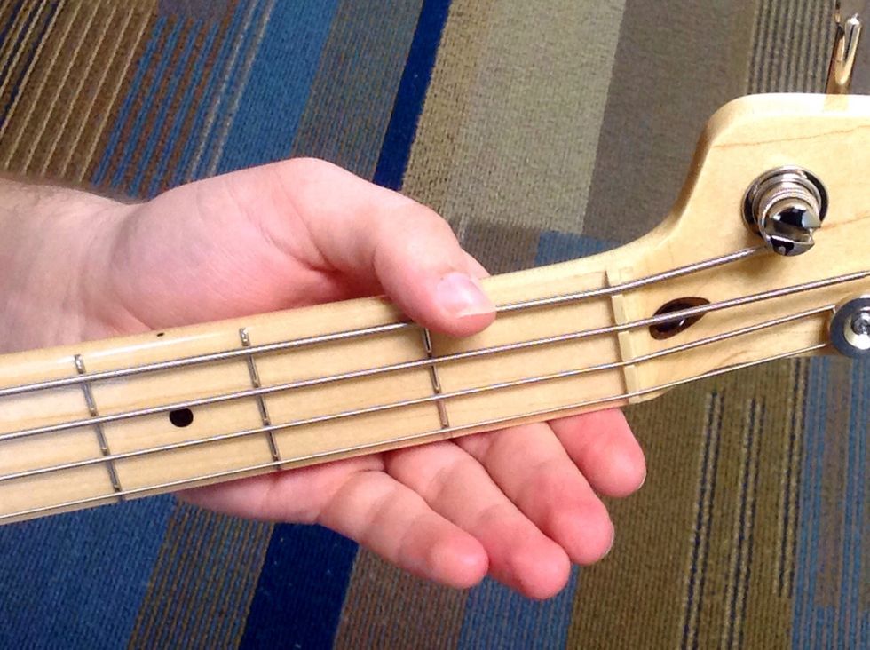 Playing this string without placing any fingers on the fretboard. This will be the third note in the scale, D.