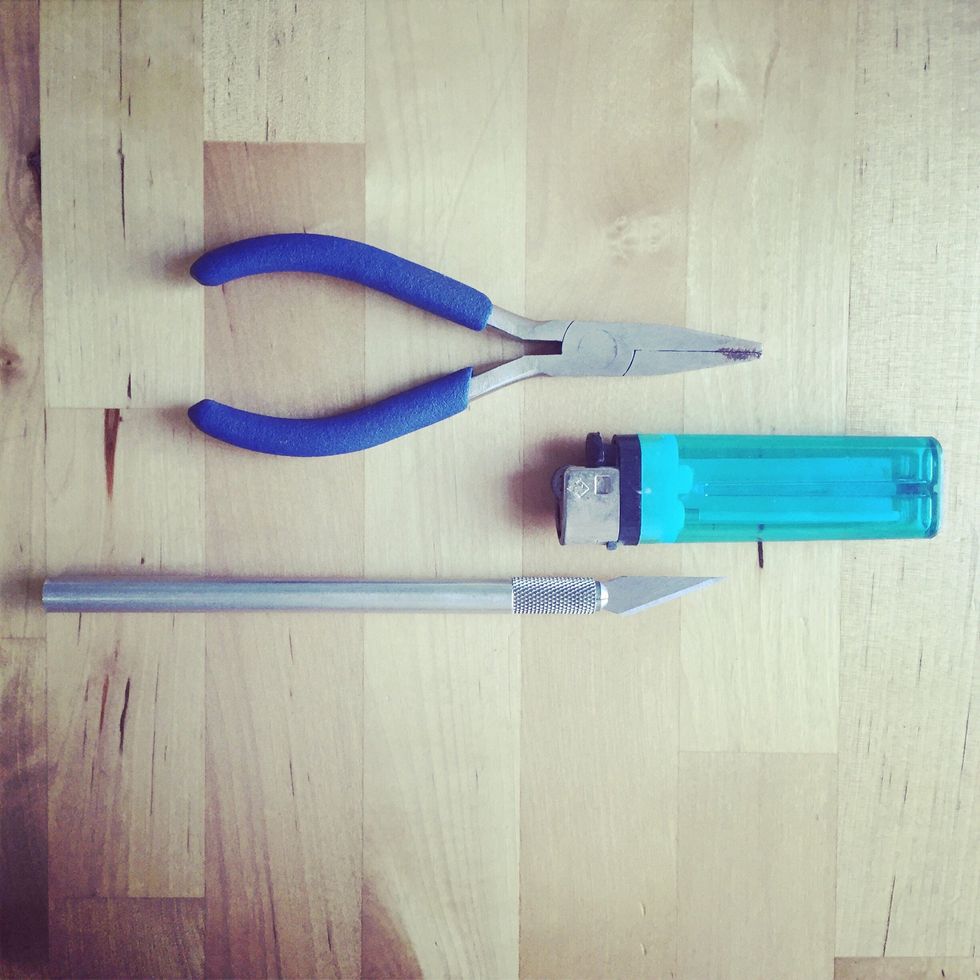 Pliers to remove the lanyard clip, lighter to burn off the frayed lanyard ends, x-acto knife to cut the lanyard (scissors will do too).