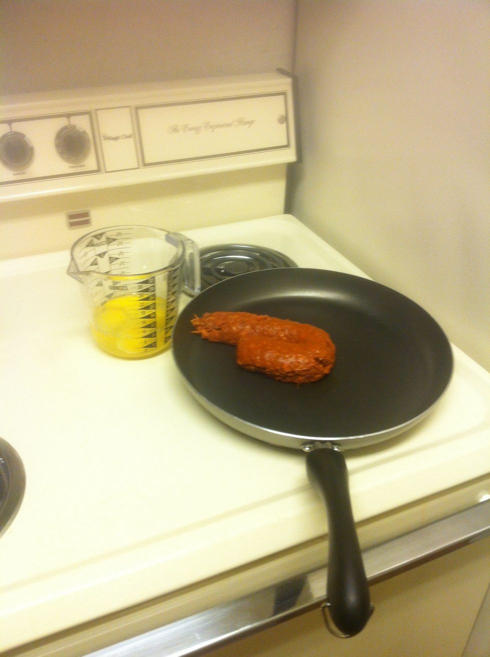 Plop the chorizo in a skillet and begin cooking on medium to high heat. (Looks like poop...).   Have 4 eggs cracked and scrambled on standby.