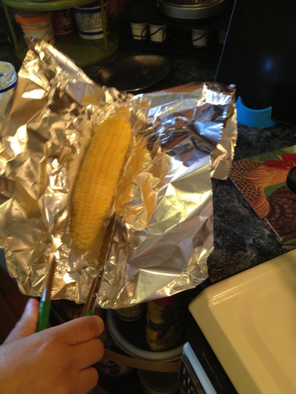 Plop the hot corn inside and move around as to get mayo all over the hot corn.