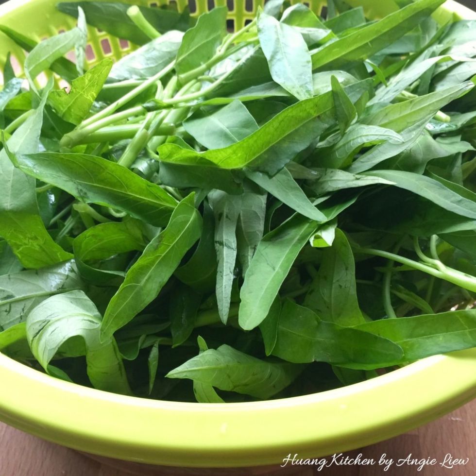 Pluck or cut the water spinach into smaller sections and set aside.