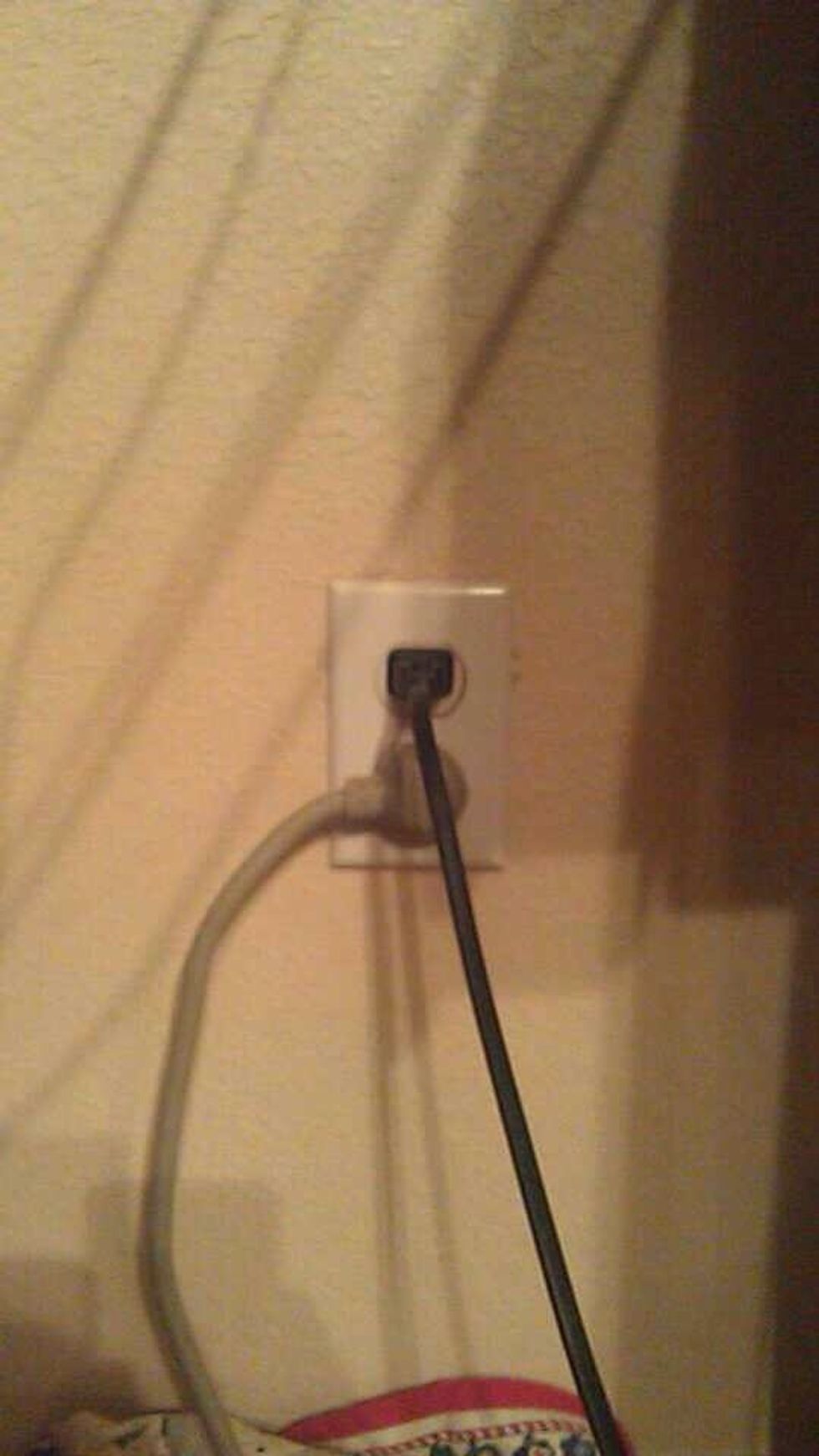 Plug in the power cord into any wall plug up