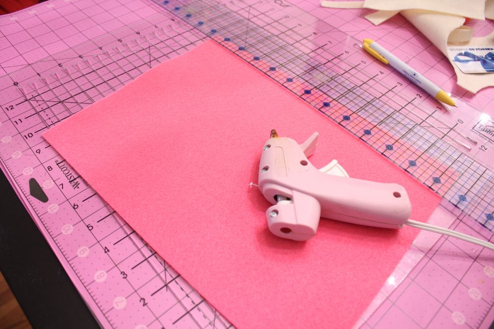 Plug in your glue gun- cut your felt in half lengthwise then cross wise